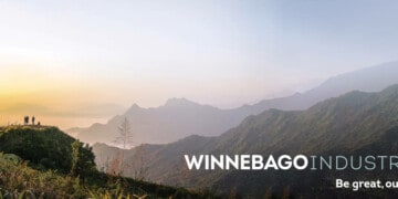 Winnebago Industries logo and tagline over a landscape mountain scene
