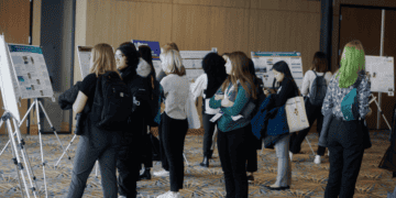 college women engineers at a poster competition