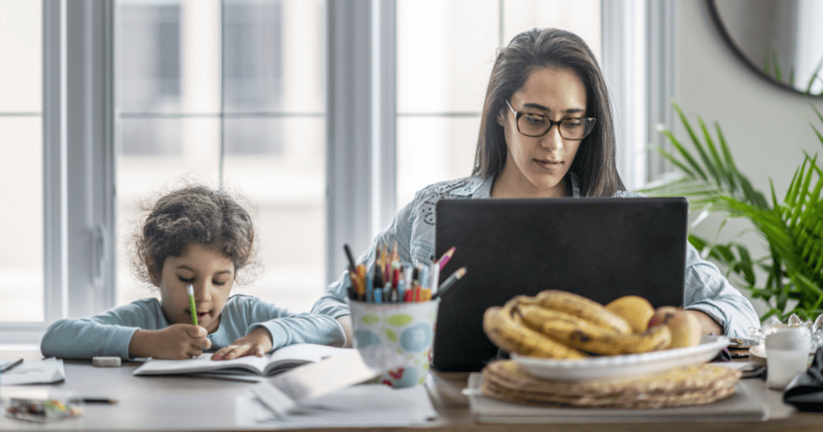 woman engineer working from home with her daughter