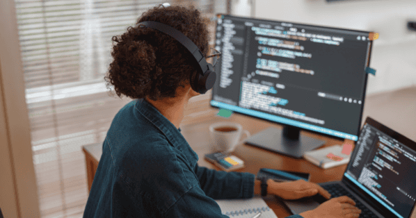 women in data science working on two computer screens